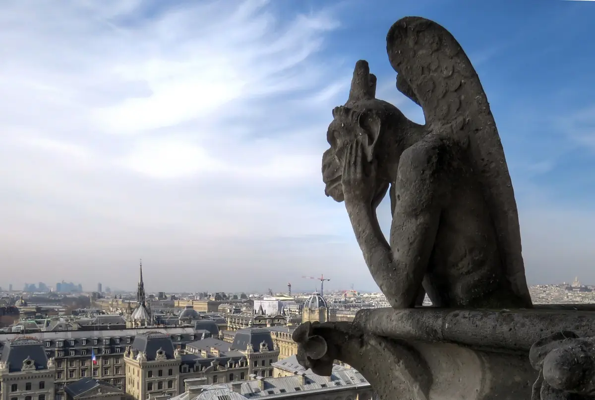 A chimera on the gallery of Notre-Dame overlooking Paris